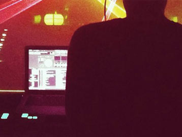 Cyril Picard with his laptop on stage