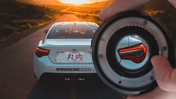 Illustration of the zoom effect using a lens Example image of the zoom effect using a lens on the rear of a car