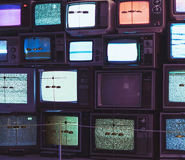 Depiction of various video formats on different television screens Wall of TVs with various old TV screens to represent different video formats