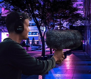 Illustration of postproduction sound effects in videos Cameraman with a microphone illustrating sound effects for dubbing
