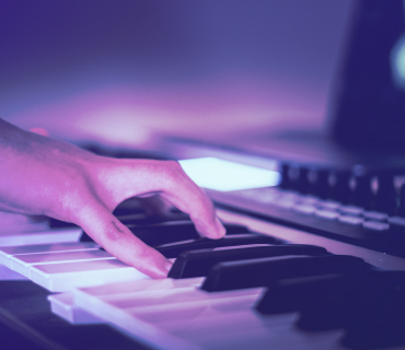 Creating musical intros Close up of hand playing keyboard
