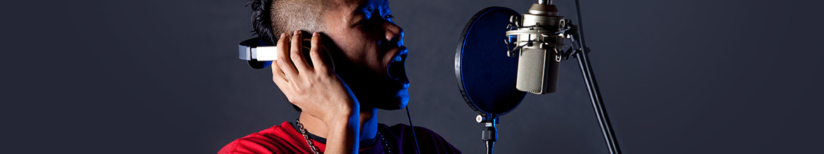Make vocals sound fatter using the Split Harmonizer effect Singer with headphones and a microphone