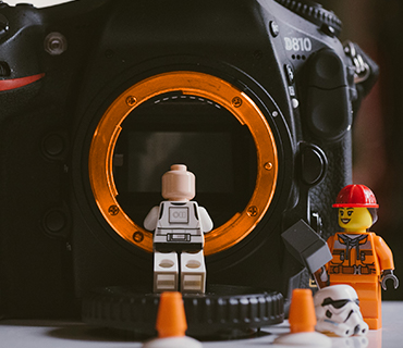 Stop motion movie recording with characters Characters in front of a camera to depict the recording of a stop motion film